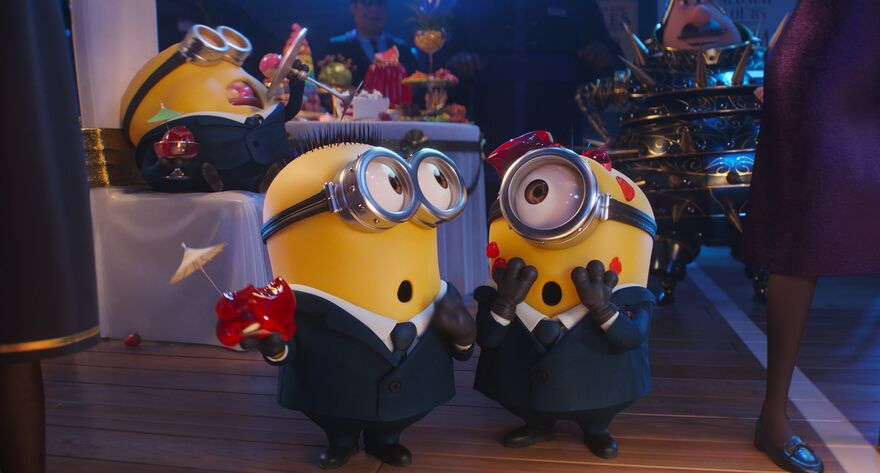 Three minions in suits enjoy lots of jelly and ice cream