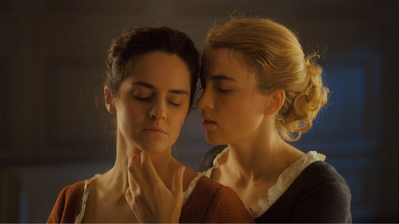Two women in historical dresses in a close embrace