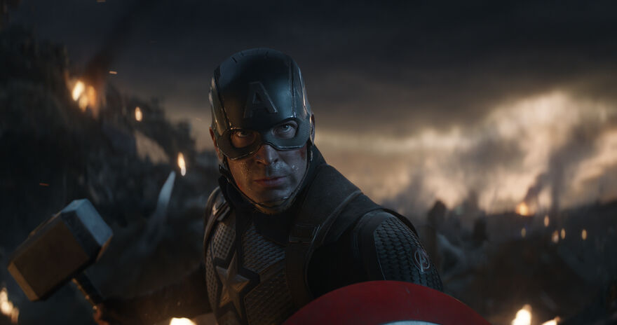 Captain America stands determined holding Thor's hammer