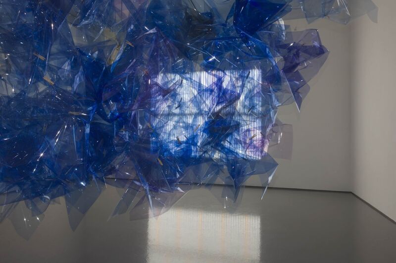 From Spencer Finch's exhibition. A large, blue sculpture made of translucent material, which reflects the light.