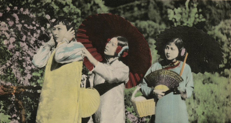 Still from vintage film Toll of the Sea shows three young Chinese women in a garden