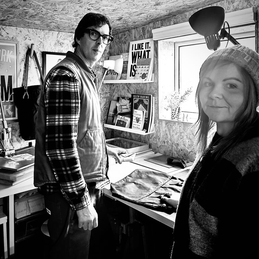 Black and white photo of a man and a woman in a studio