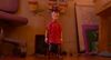 Woody in Toy Story 5 wearing a red poncho