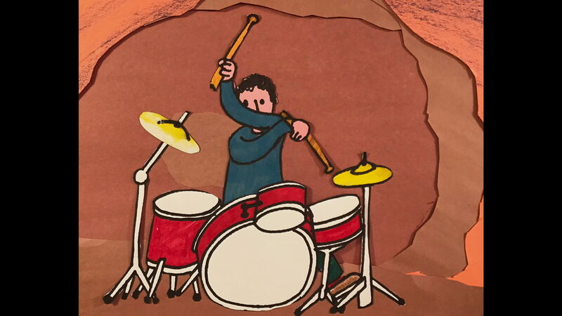 Animated still – a man playing drums in a cave