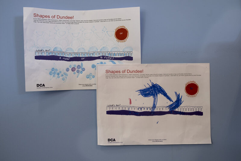 Two Shape of Dundee activity sheets on the wall of Create Space