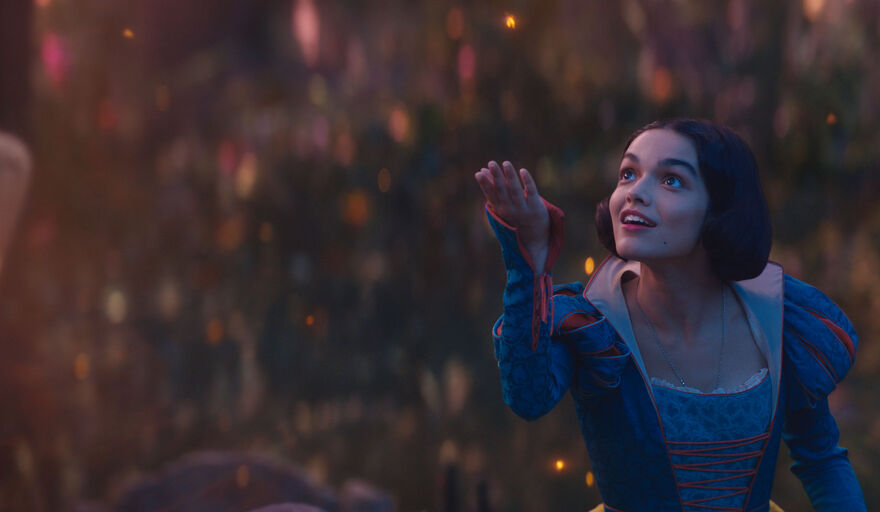 Snow White smiles and looks up at the sky.