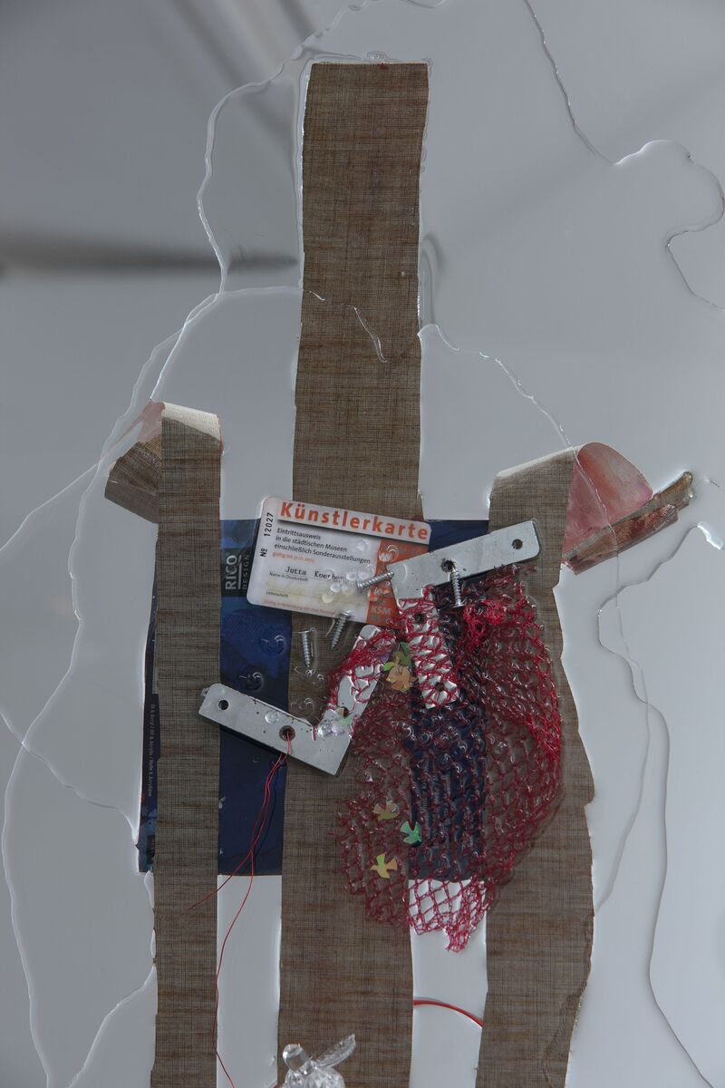 From Jutta Koether's exhibition. Everyday objects - strips of fabric, an ID cards. wrapper and nuts and bolts are encased in clear liquid acrylic. 