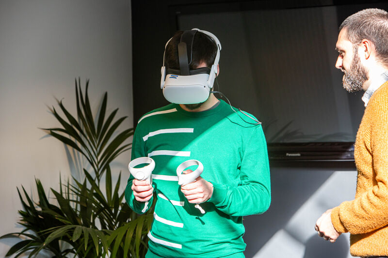 A person wears a VR headset.