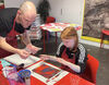DCa artist and young person creating prints in DCA Create Space
