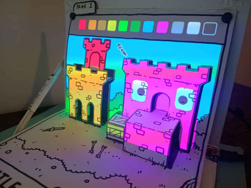 Paper book with projected colourful game