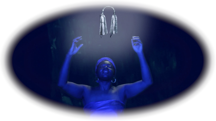 a lady bathed in blue light with arms outreached in a hazy dark oval
