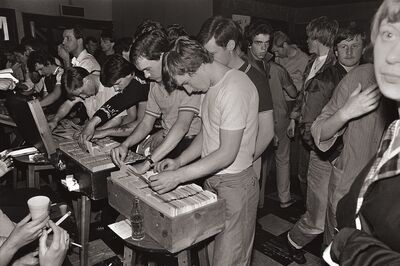 Vintage stil of young men looking at vinyl records.