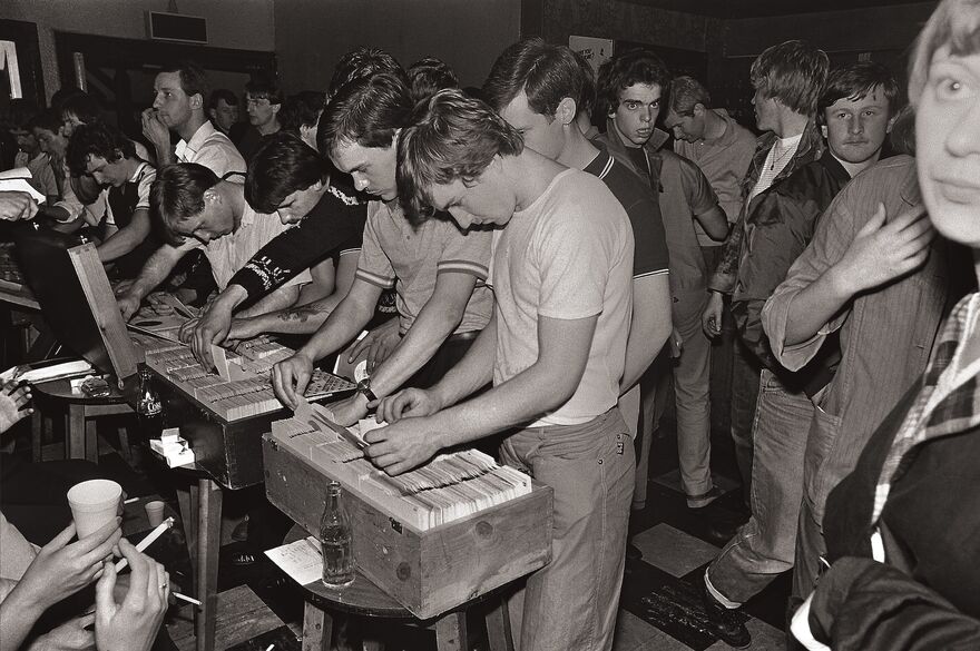 Vintage stil of young men looking at vinyl records.