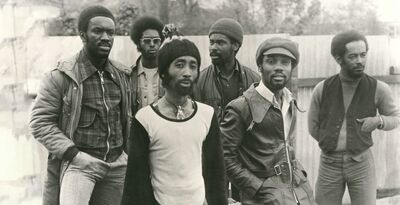 A black-and-white image of the band Cymande in the 1970s.