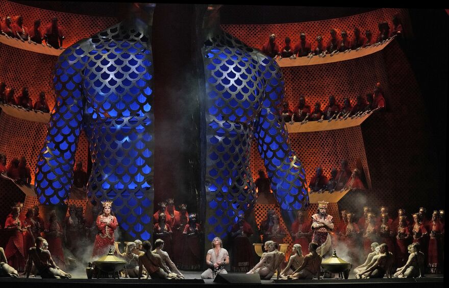 A colourful opera stage filled with singers