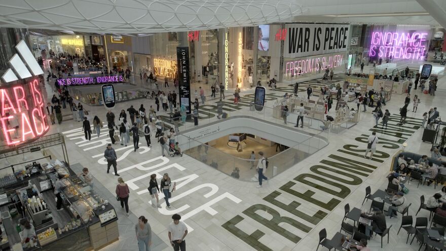 A shopping mall covered in quotes by George Orwell