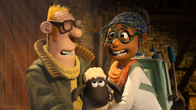 A claymation man and woman smile at each other while a sheep looks at them
