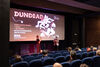 Michael Coull interviewing Alex Masciotra-Milstein in front of the cinema screen