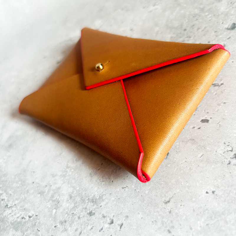 Brown leather envelope card purse with neon red trim