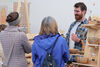 People talking to a stall holder at Crafted 2023
