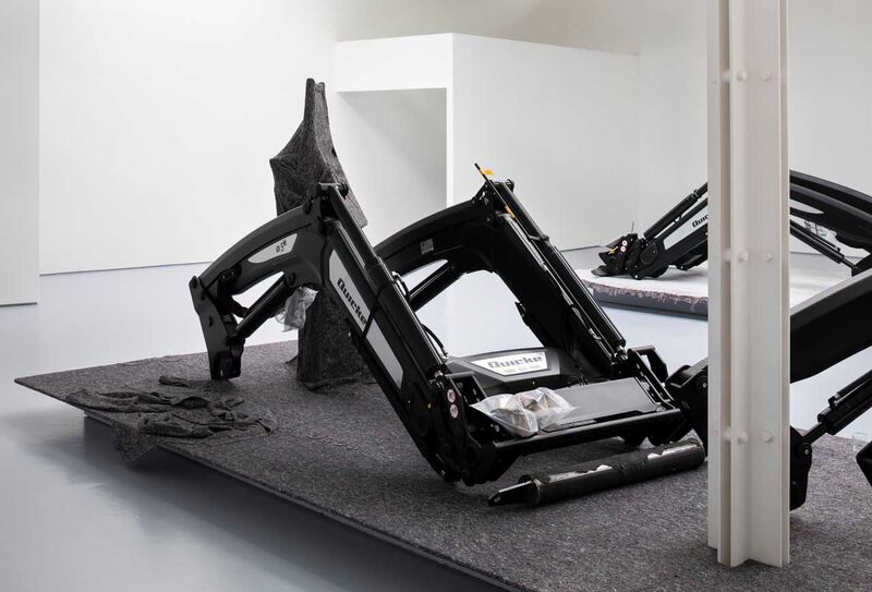 Large farm equipment sat in a gallery space