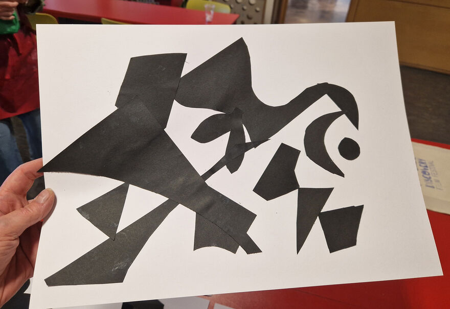 collage created with black shapes on white paper