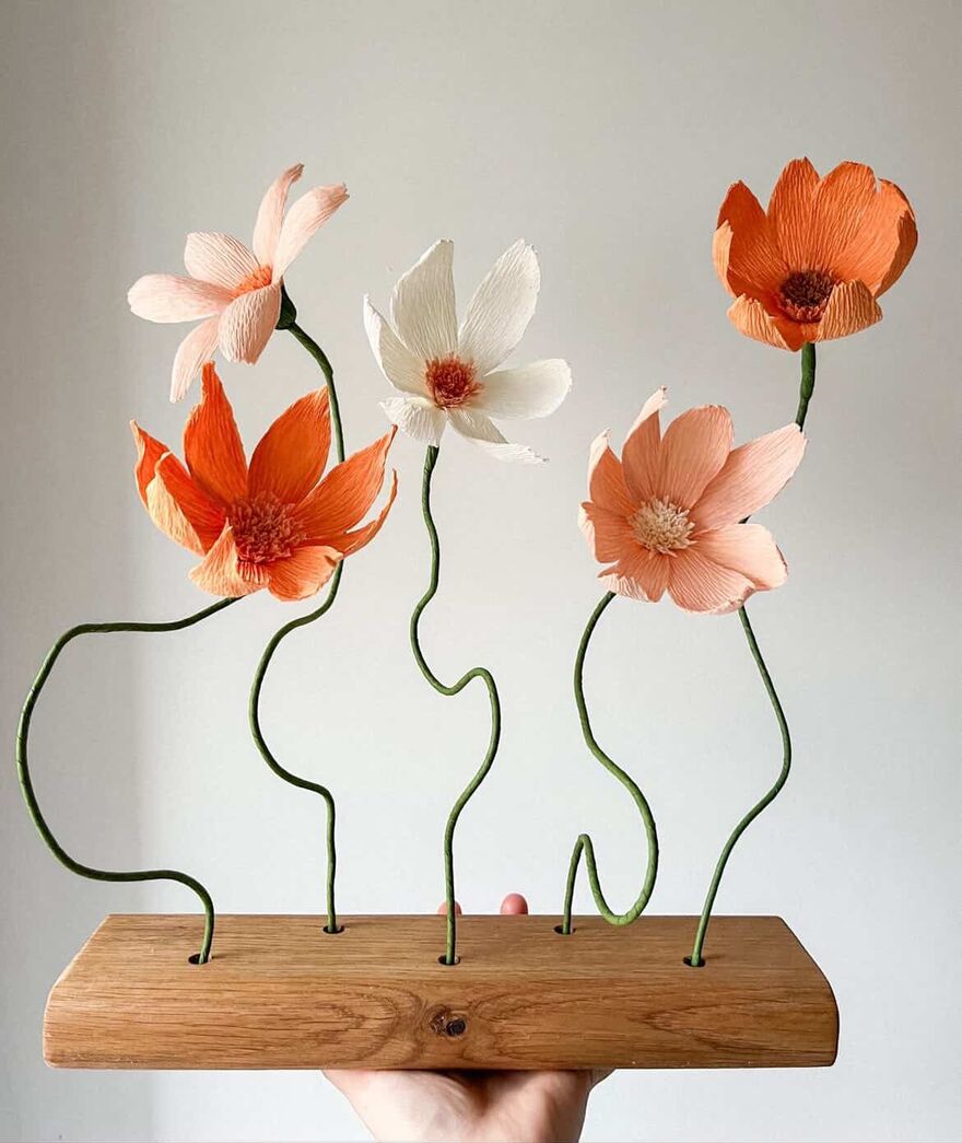 Display of 5 orage, white and peach paper flowers