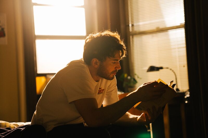 Chris Evans with beard and wild hair in Materialists