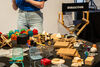 Table covered in animation props with Director chair in the background