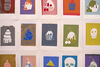 Colourful screenprints of cakes and skulls on the wall of Gallery 1 for Spring Holiday Pop-up