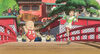 A still from the film Spirited Away shows a young girl running across a Japanese bridge while a large baby and a group of villagers wave at her.